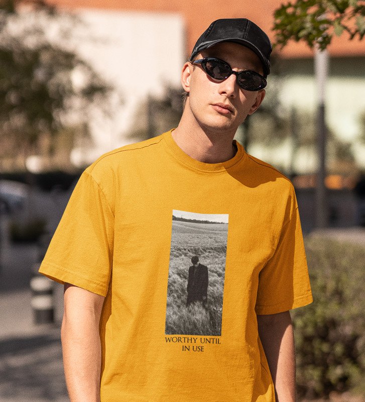 Worthless Life, Cityscape Elegance: Yellow Men's Oversized Tee with Captivating Front Graphic